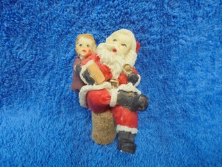 Joulupukki ja tyttö, keraaminen/ luonnonkorkki pullonkorkki, E621
