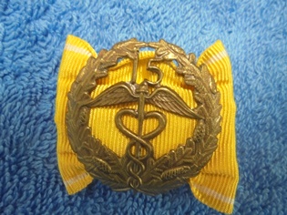 Keskuskauppakamarin ansiomerkki 15v, R940