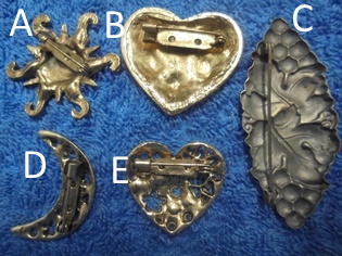 Metallinen rintakoru, aurinko tai sydn tai viinikynns tai kuu, V817