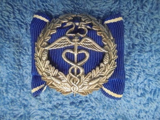 Keskuskauppakamarin ansiomerkki 25v, R515